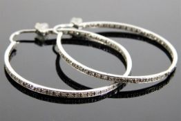 A pair 18ct white gold hoop earrings set with appr