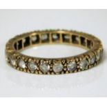 A 9ct gold eternity ring set with paste stones 2.4