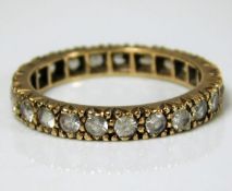 A 9ct gold eternity ring set with paste stones 2.4