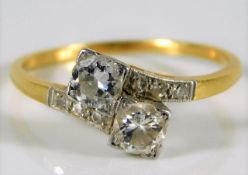 An 18ct gold art deco period diamond crossover rin