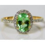 An 18ct gold ring set with diamond & peridot 2.4g