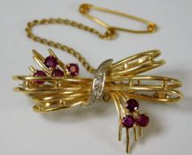An 18ct gold brooch set with diamonds & ruby 7g