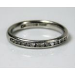 A platinum half eternity ring set with approx. 0.1