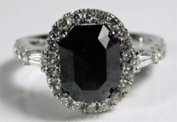 An 18ct white gold ring set with a black diamond o