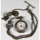 A silver pocket watch with silver Albertina with e