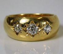 An 18ct gold gypsy style ring set with approx. 0.8
