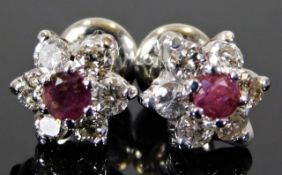 A pair of 14ct white gold earrings set with approx