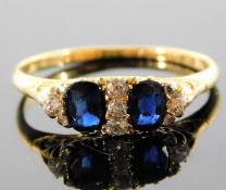 An 18ct gold diamond & sapphire ring 3.4g size T