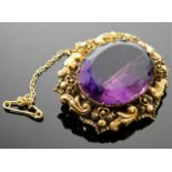 An antique yellow metal brooch set with amethyst 1