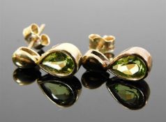 A pair of 9ct gold peridot earrings 2.6g