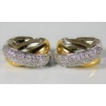 A pair of 18ct two colour gold earrings set with a