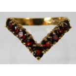 A 9ct gold wishbone ring set with garnet 2.9g size
