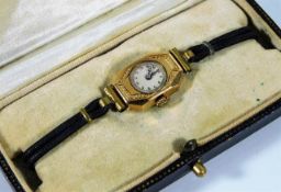 An art deco 9ct gold watch with original box, runs