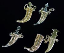 Four 21ct gold Arabian dagger pendants 15.9g