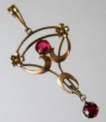 An antique 9ct gold pendant set with ruby 1.7g