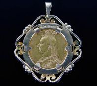 A 9ct gold mounted Victorian 1890 full gold sovere