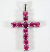 A 9ct white gold cross set with ruby 1.1g