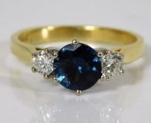 An 18ct gold ring set with sapphire & approx. 0.3c