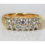 An 18ct gold diamond ring set with fourteen diamon