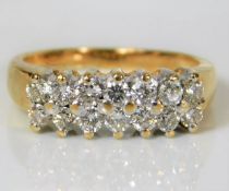 An 18ct gold diamond ring set with fourteen diamon