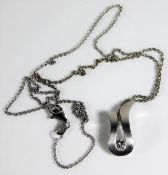 An 18ct white gold necklace with pendant set with