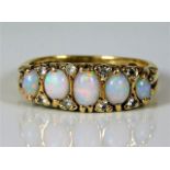 A 9ct gold ring set with opal & paste stones 4.8g