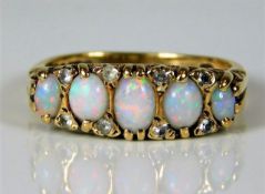 A 9ct gold ring set with opal & paste stones 4.8g