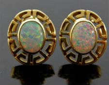 A pair of 14ct gold earrings set with opals 5.5g