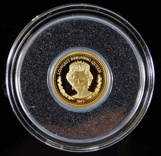 A small 24ct gold QEII 1000 Torpor proof coin in c
