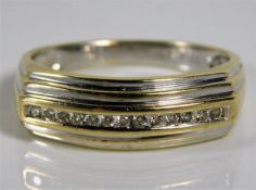 A 14ct two colour gold half eternity ring set with