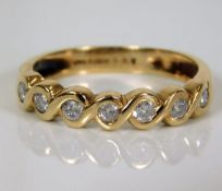 A 9ct gold half eternity ring set with approx. 0.3