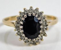 A 9ct gold ring set with sapphire & 0.14ct diamond 2.7g size P/Q
