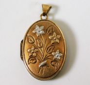 A 9ct gold locket with two tone gold floral decor