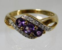 A 9ct gold ring set with amethyst & diamond 2.8g s