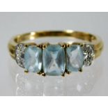 A 9ct gold ring set with topaz & diamond 3g size S
