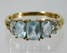 A 9ct gold ring set with topaz & diamond 3g size S