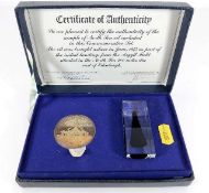 A 1975 commemorative oil sample with silver proof