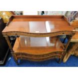 A serpentine fronted mahogany buffet with gallery