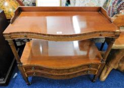 A serpentine fronted mahogany buffet with gallery