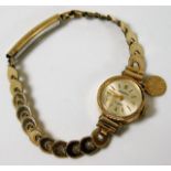 A ladies gold wristwatch & strap, strap tests as 1