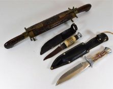 A hunting knife with fleur de lys mark to handles,