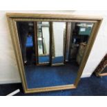 A decorative gilt framed mirror 44in high x 34.5in