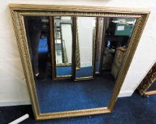 A decorative gilt framed mirror 44in high x 34.5in