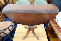 A small regency styled drop leaf occasional table