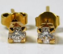 A pair of yellow metal earrings, test as 18ct gold