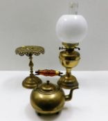 A brass trivet, one oil lamp & a brass kettle