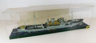 A model of military ship in case 24in long inc. Pr