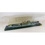 A model of military ship in case 24in long inc. Pr