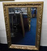 A decorative gilt framed mirror 42.5in high x 30.2