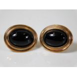 A pair of 9ct gold earrings set with onyx 3.1g